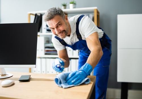 A janitor performing Deep Cleaning in East Peoria IL for an office