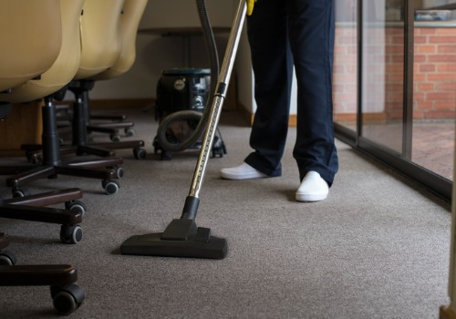 A janitor vacuuming a floor during Office Cleaning in Morton IL