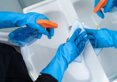 Cleaning a sink while healthcare cleaning Morton IL