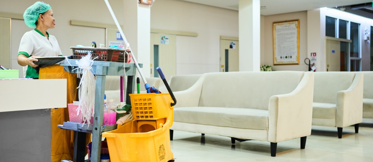 A team member from Pro Kleen Solutions, a professional healthcare & medical facility cleaning in Central Illinois, pushes a cleaning card down a hospital waiting area