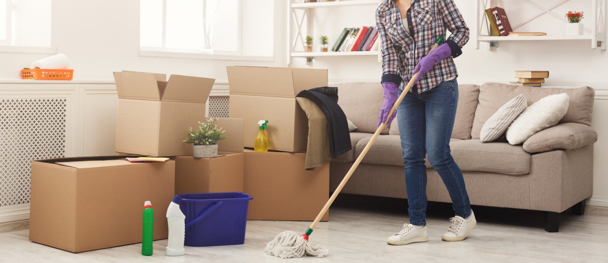 A team member from Pro Kleen, which offers property management cleaning, mops a floor as part of her services