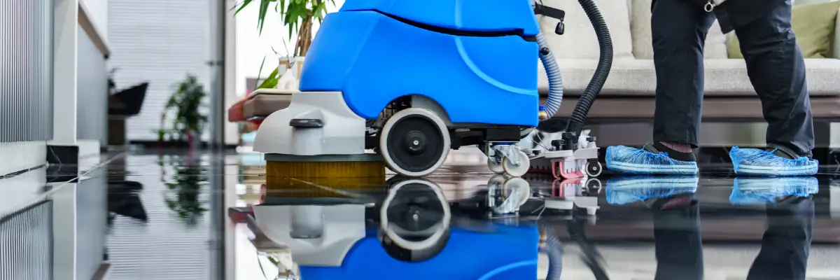 Office Cleaning Company Peoria IL, Worker cleaning office lobby floor with machine